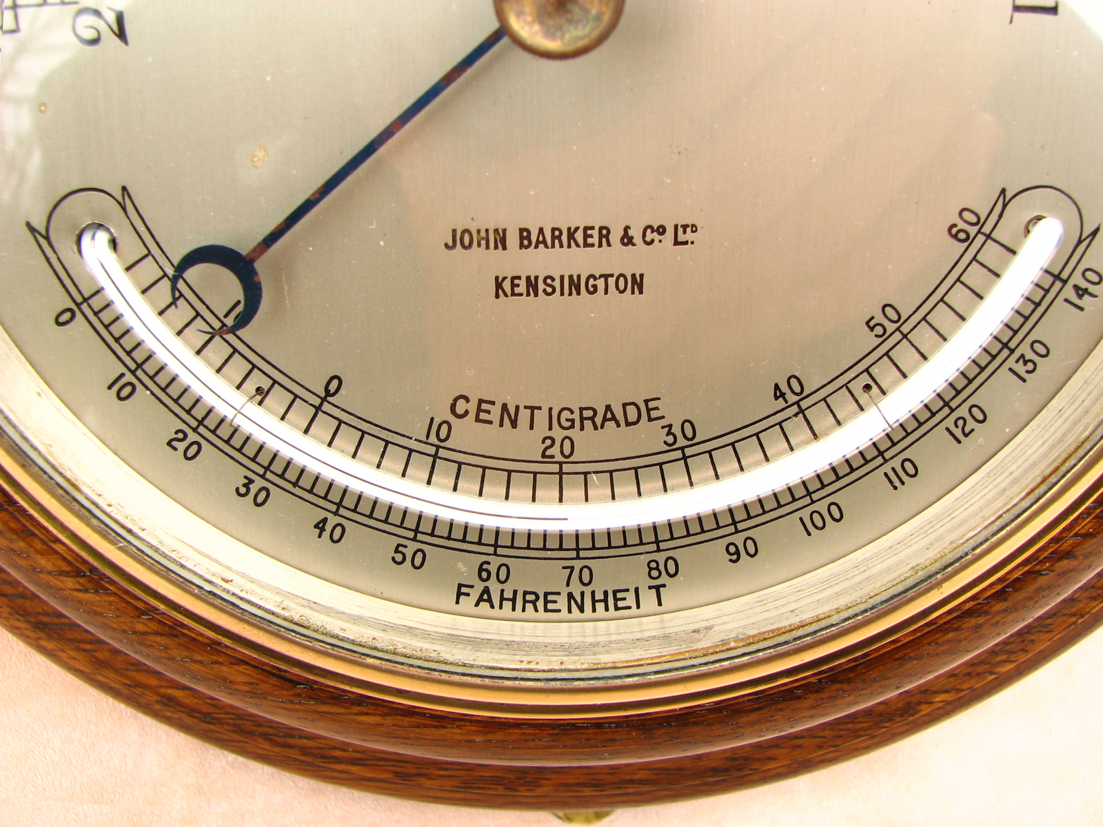 Antique John Barker marine aneroid barometer with curved thermometer
